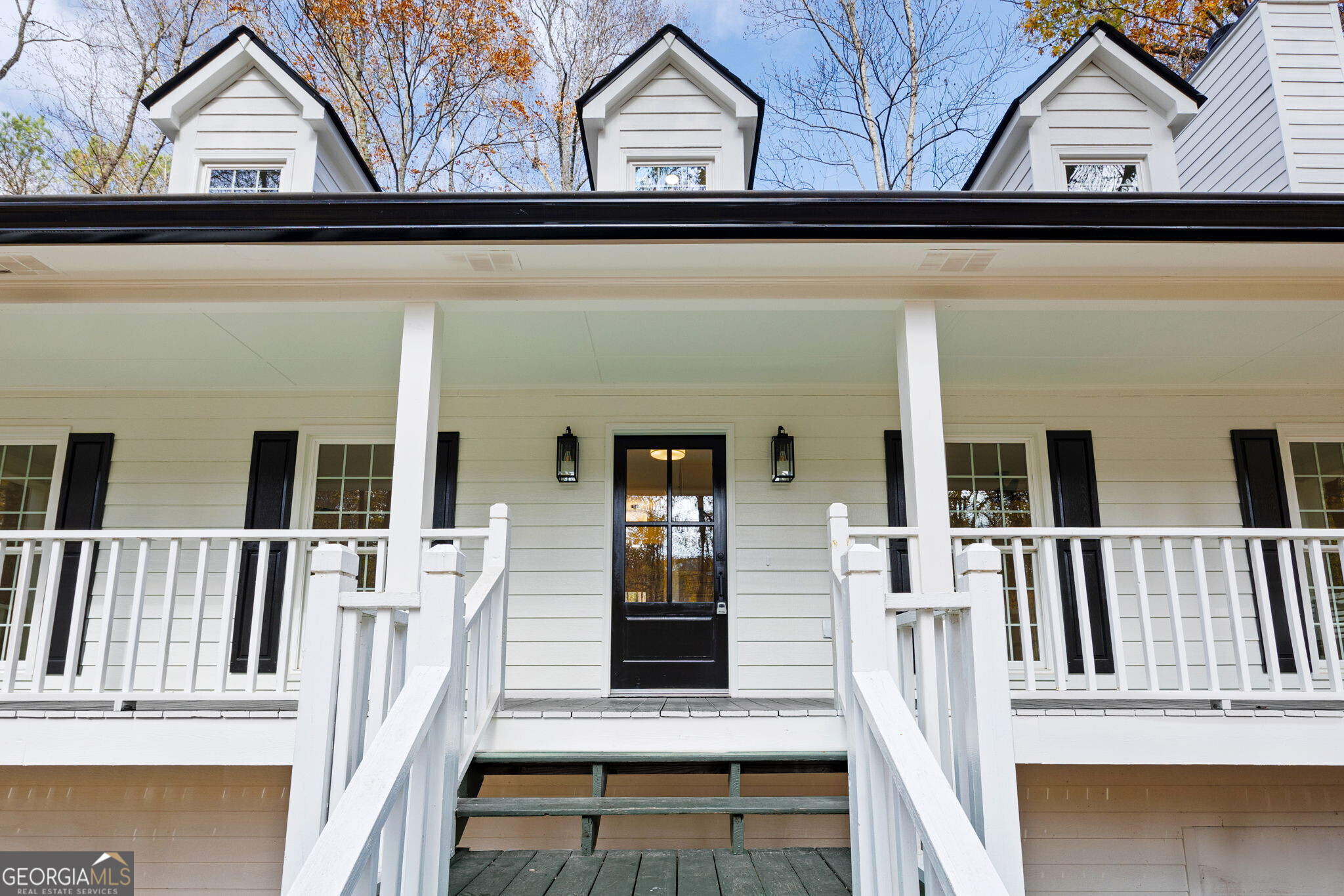 a view of front door of house with stairs