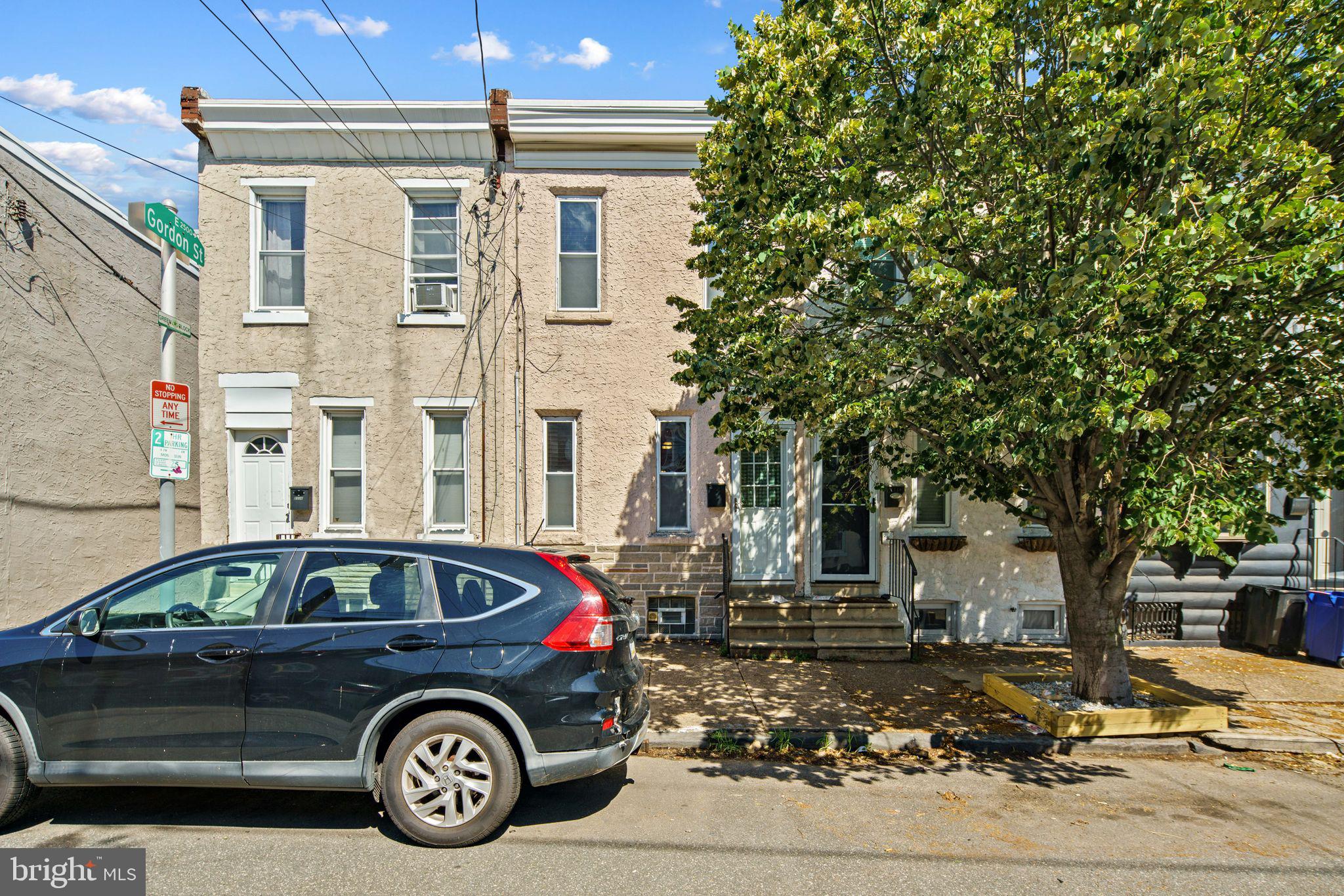 a car parked in front of a house