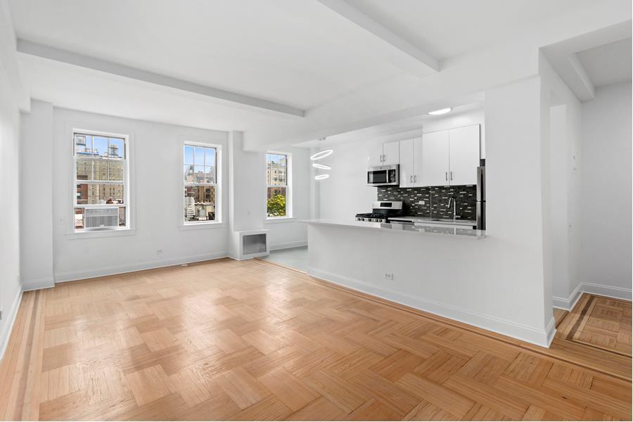 a view of a kitchen with microwave and cabinets