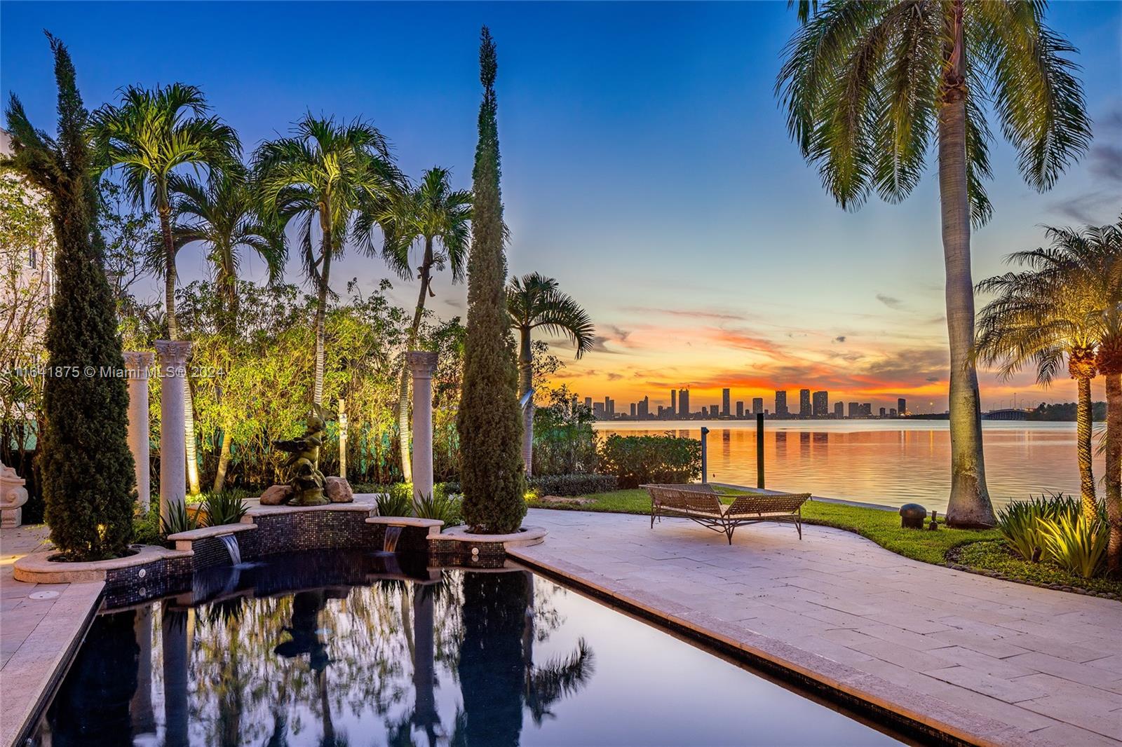 a view of a lake with a palm tree