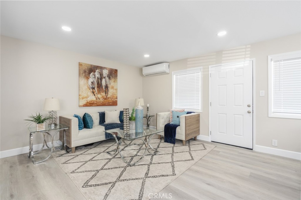 a living room with furniture and white walls