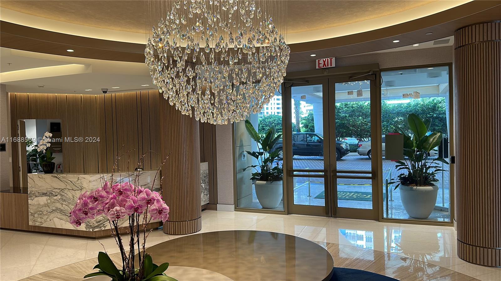 a living room with furniture and flowers