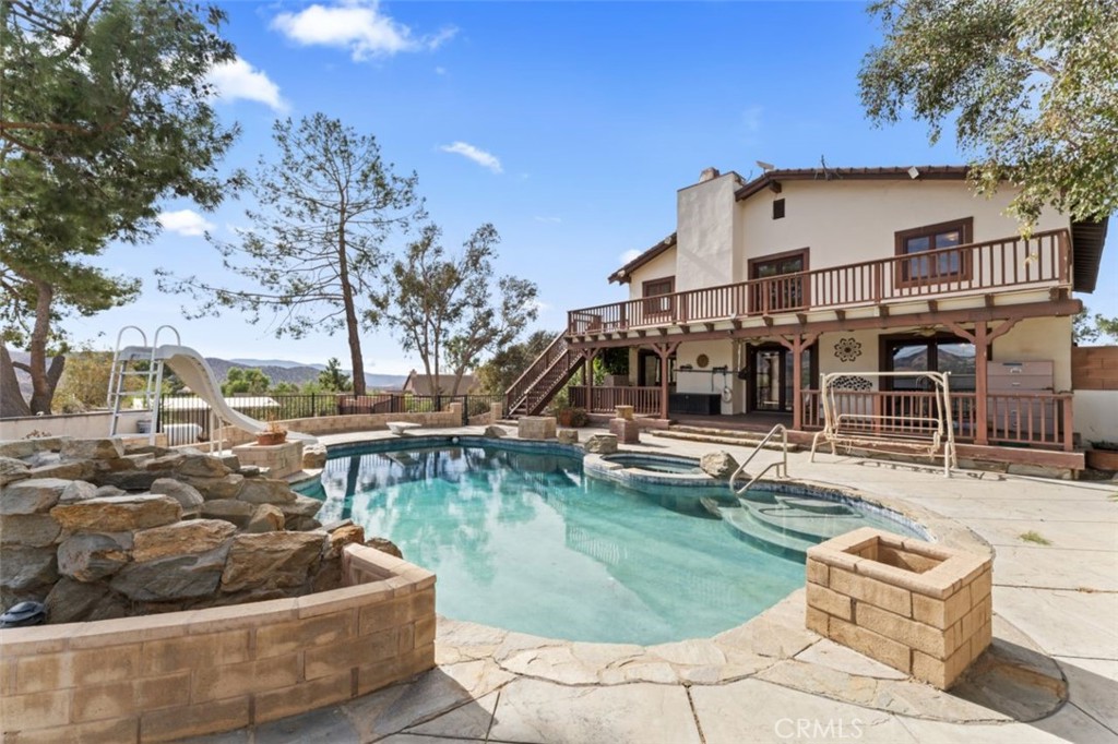 a view of a house with swimming pool