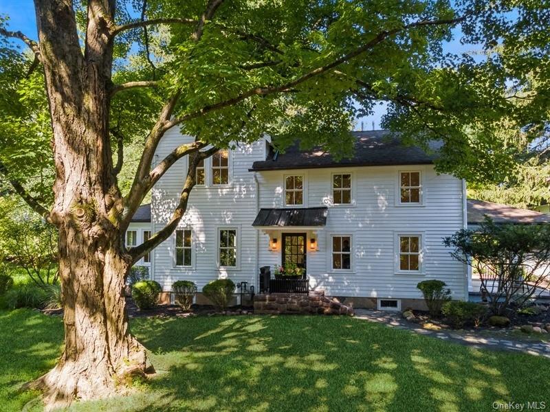 View of front of property with a front yard