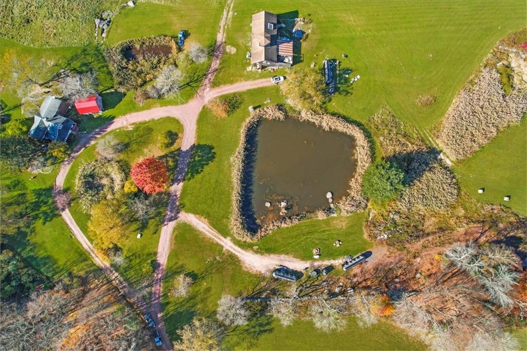 Aerial view featuring a rural view and a water view