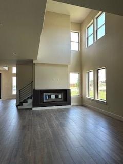 a view of a room with window and wooden floor