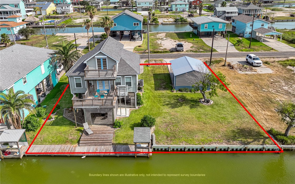 a aerial view of a house with swimming pool and ocean view