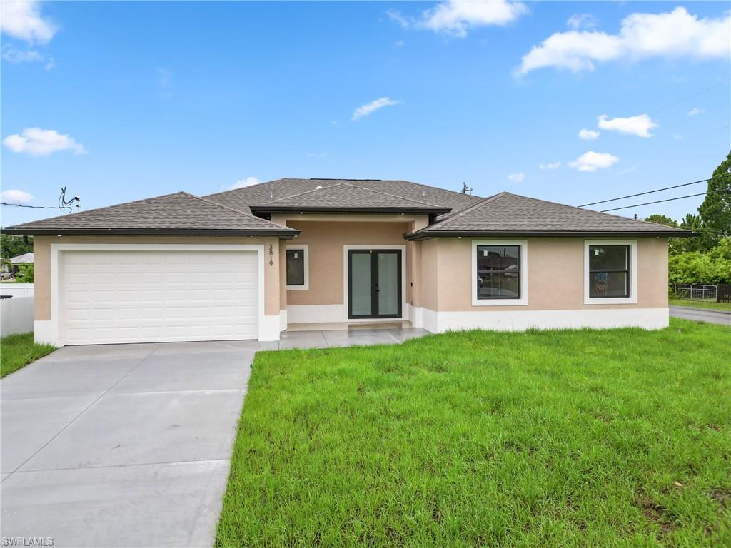 a front view of house with yard and green space