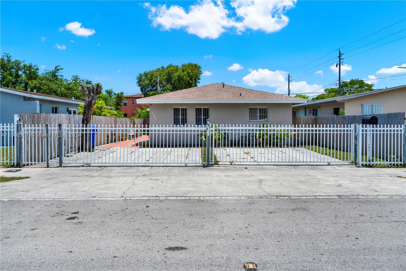 a view of a house with a fence