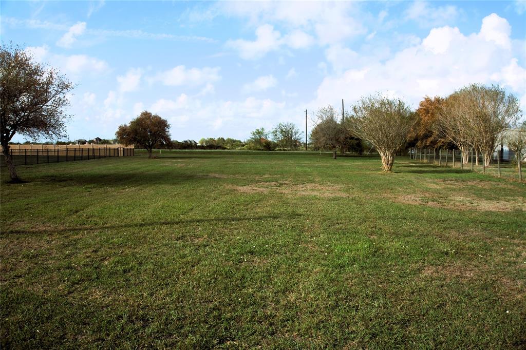 a view of a golf course with a lake