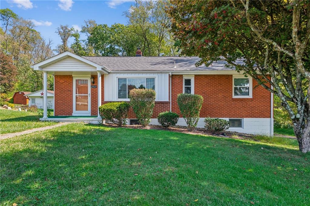 front view of a house with a yard