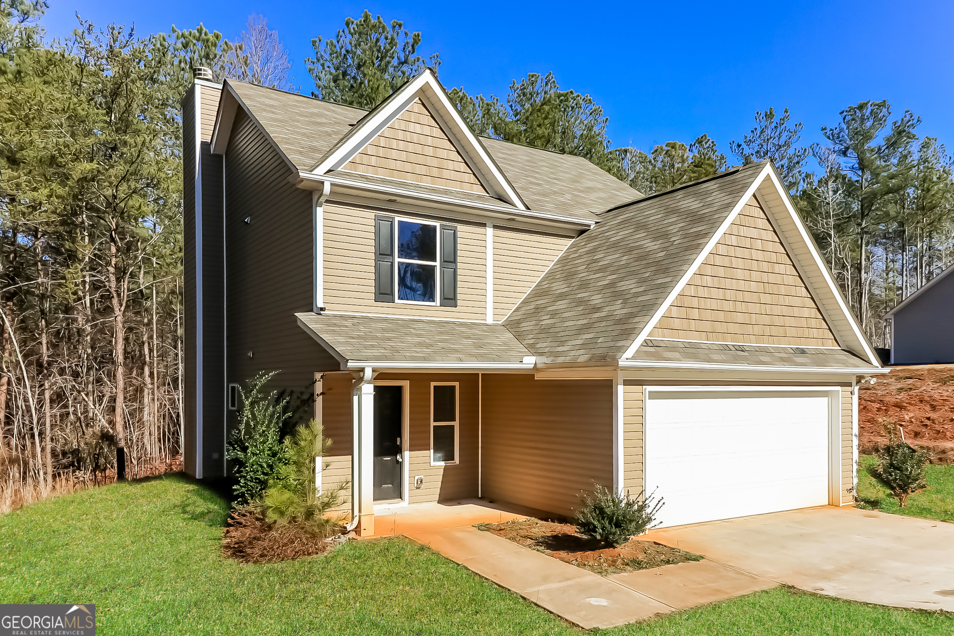 front view of a house with a yard