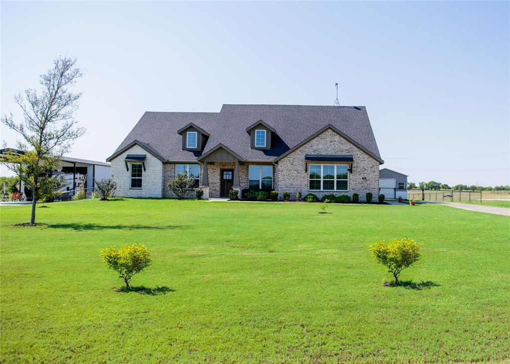 a front view of house with garden