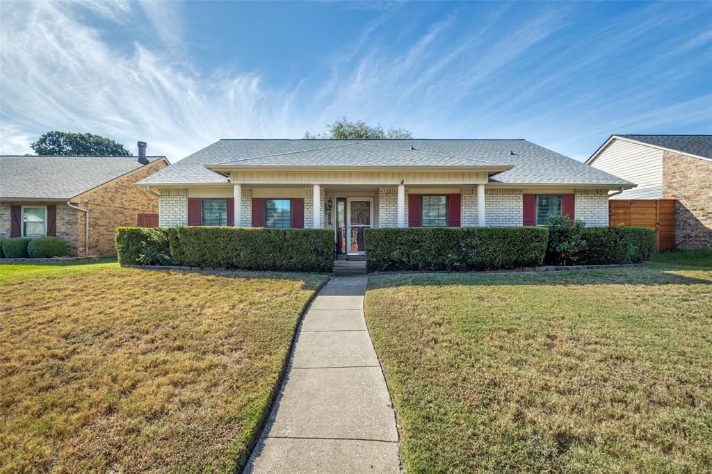 a front view of a house with yard