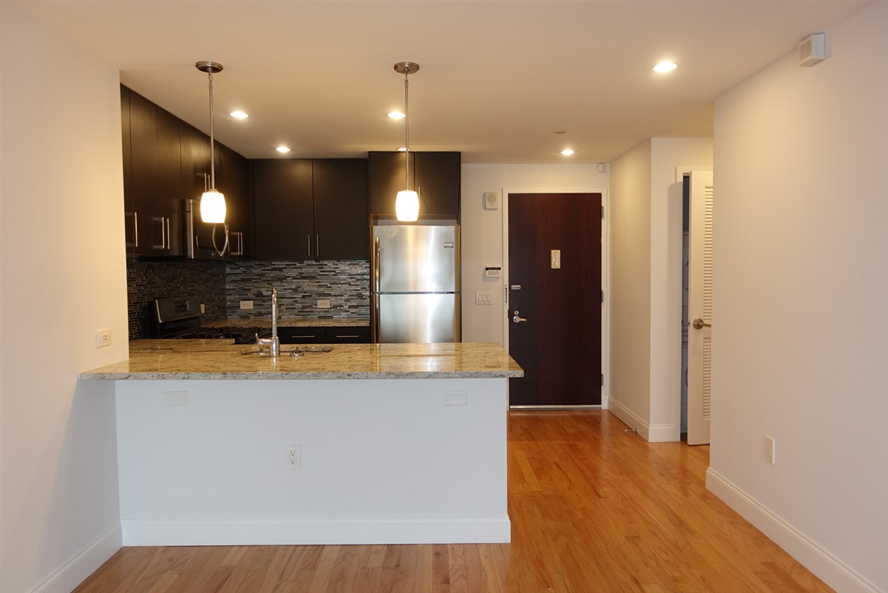 a view of a room with kitchen island