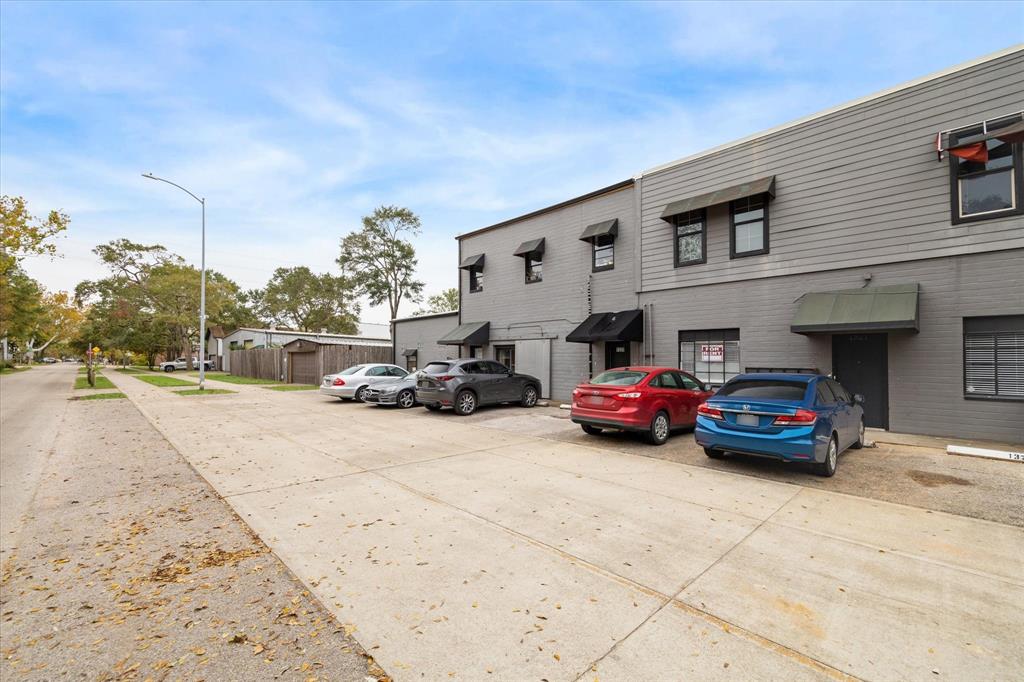 a view of a cars parked in front of a building