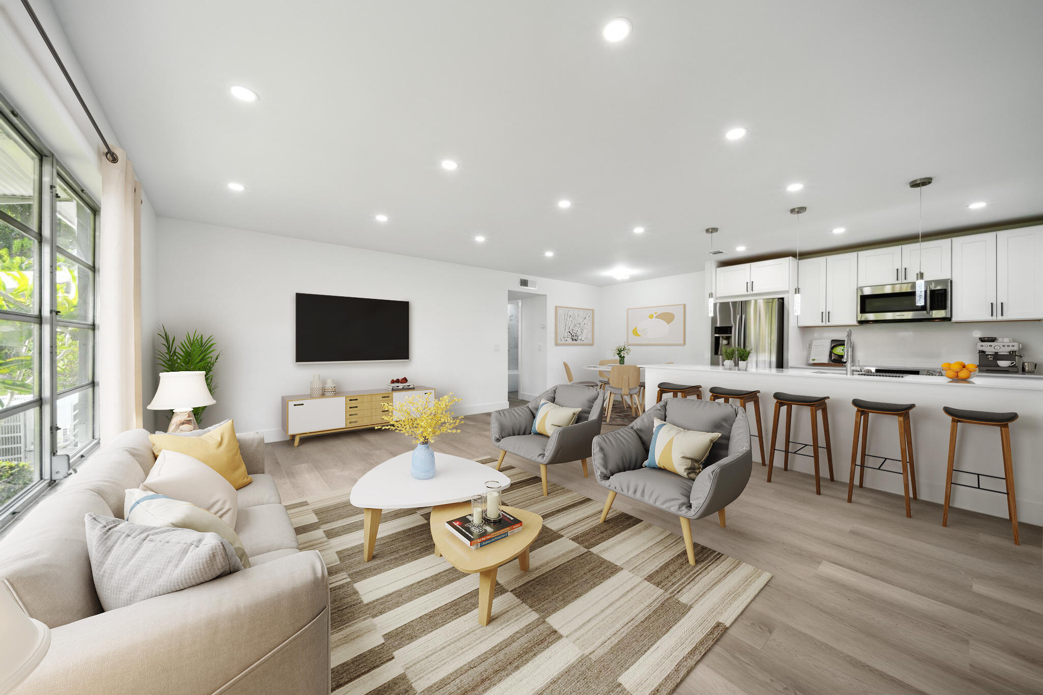 a living room with furniture kitchen view and a large window