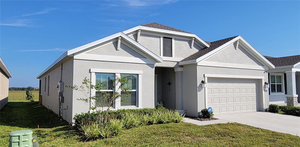 a front view of a house with a yard