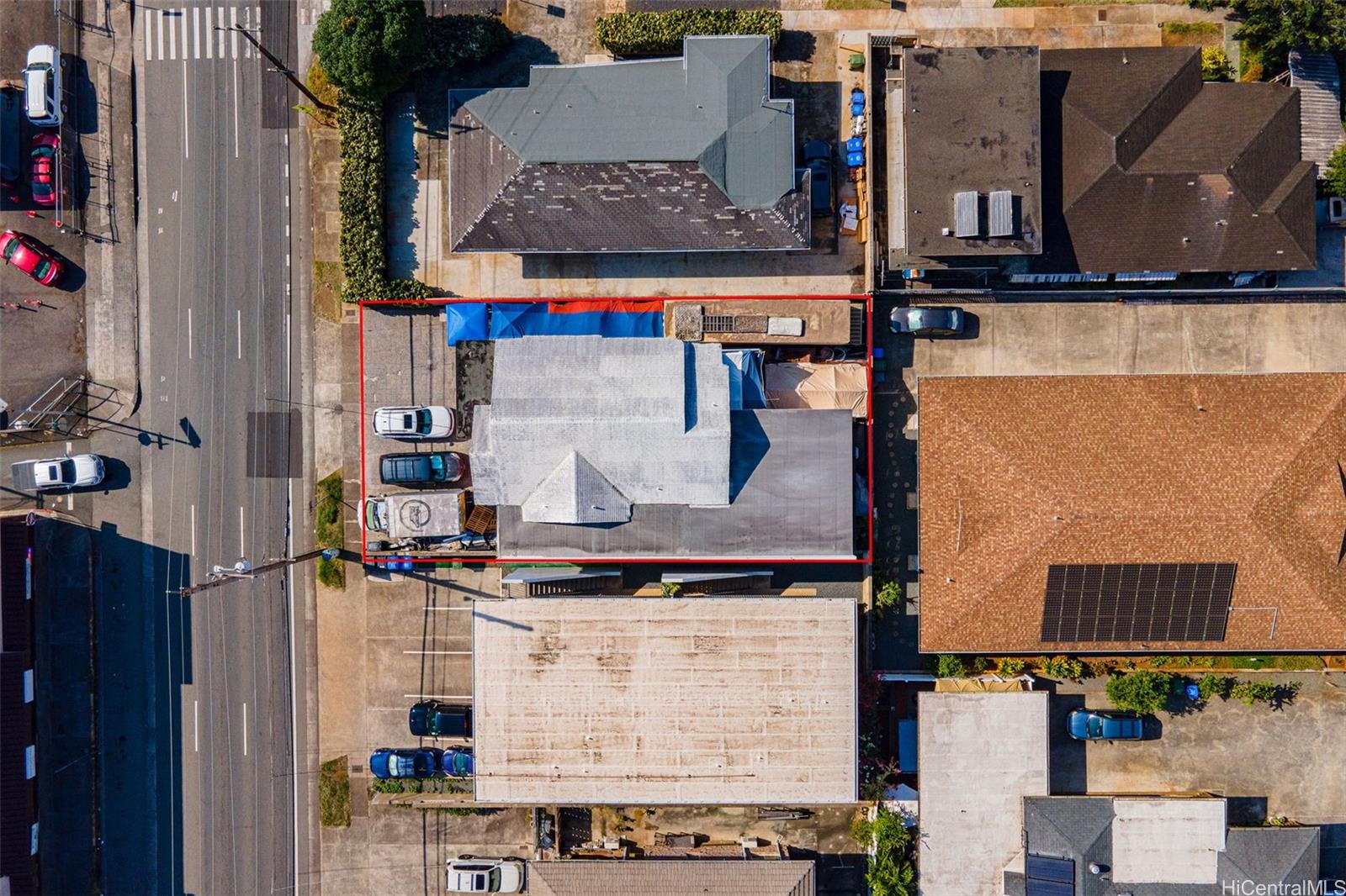 an aerial view of residential houses with outdoor space