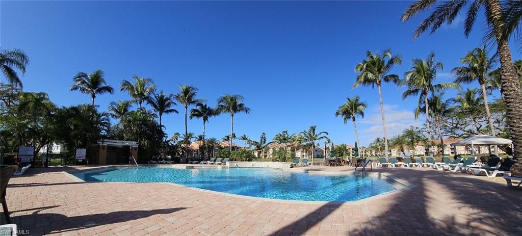 a view of swimming pool with outdoor seating