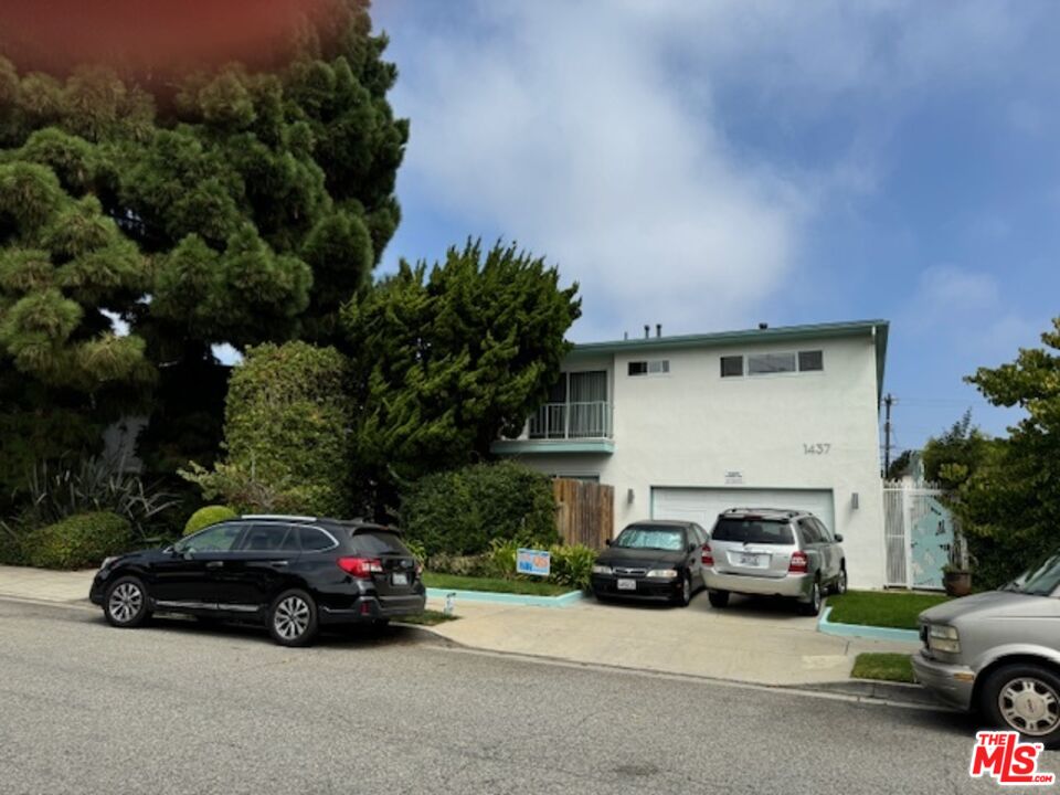 a car parked in front of a house