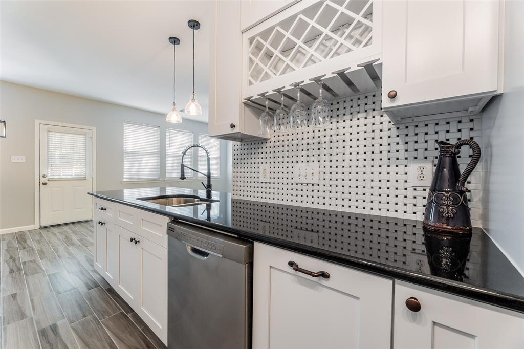 a kitchen with a sink and cabinets