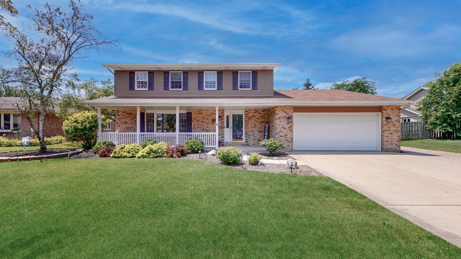 front view of a house with a garden