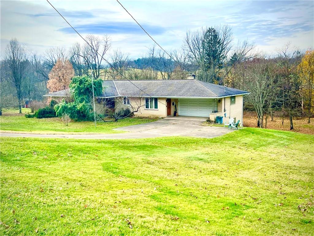 a view of a house with a yard porch and sitting area