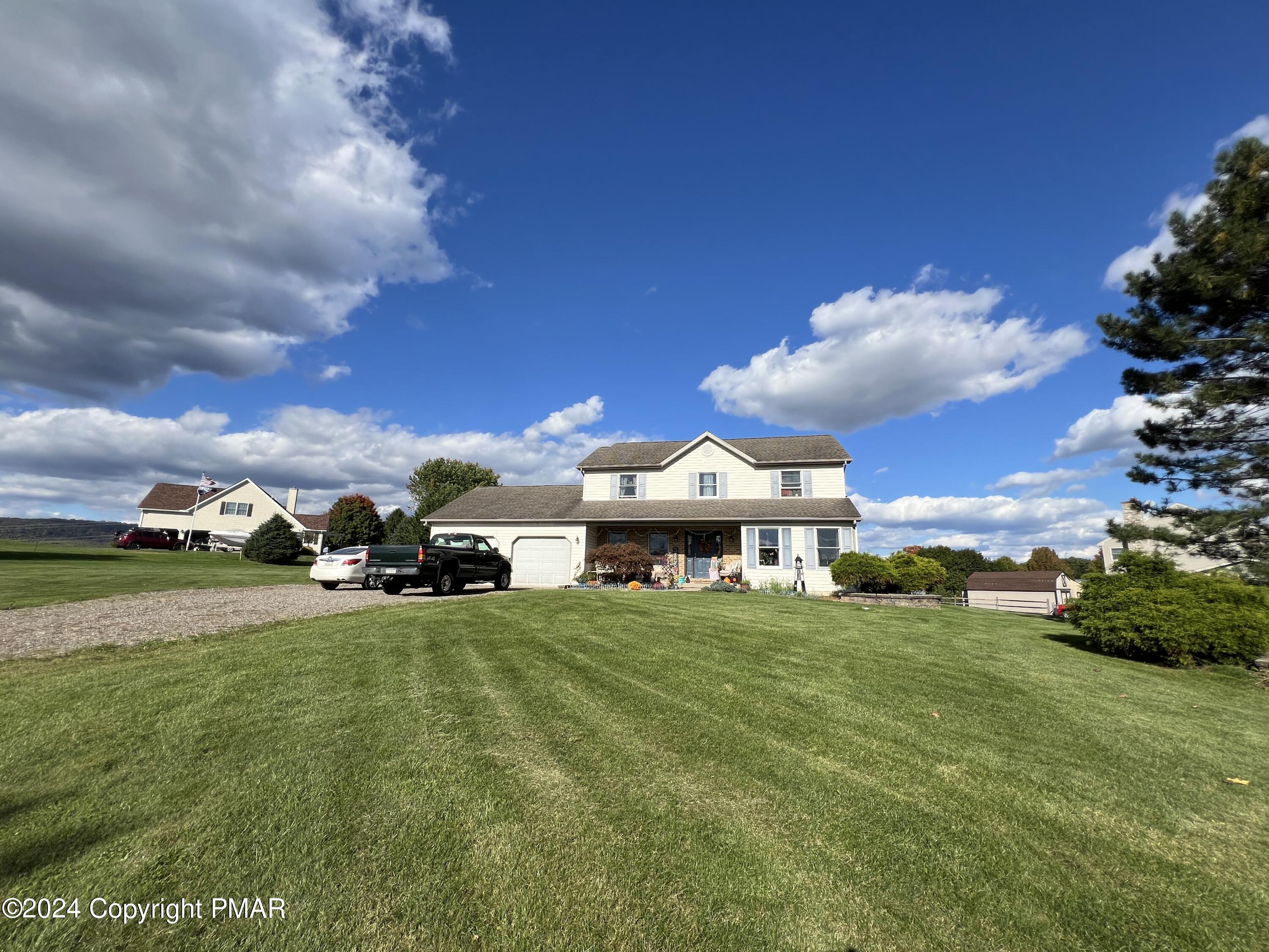 a view of a house with a big yard