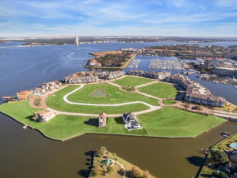 an aerial view of a golf course with a swimming pool