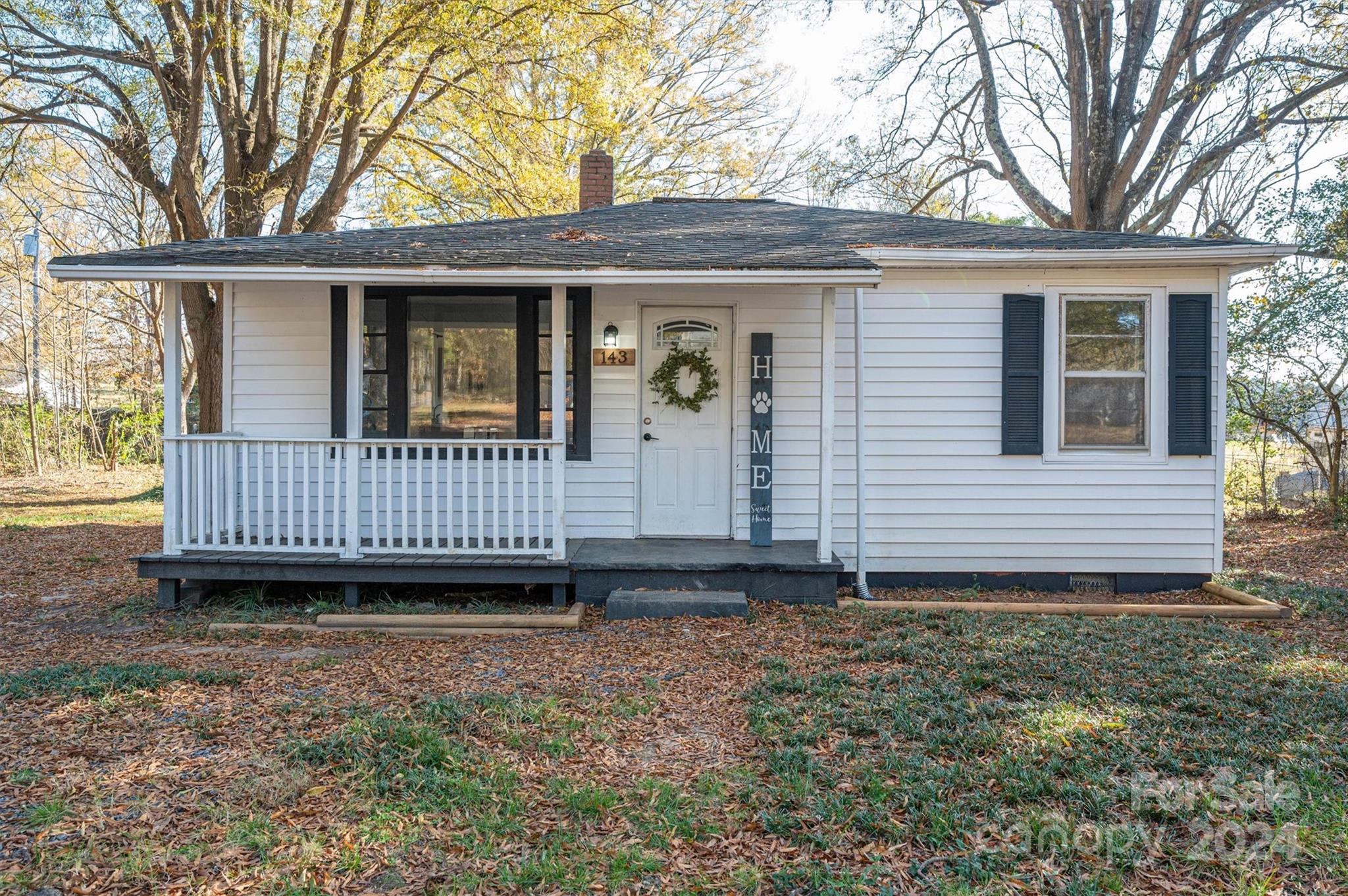 front view of a house with a yard