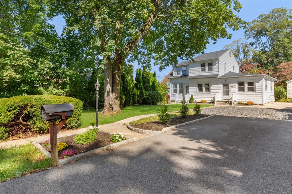 a house with trees in front of it