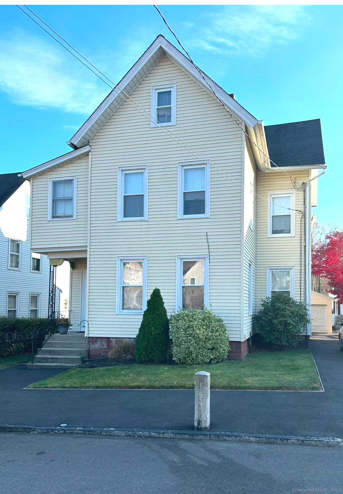 a front view of a house with a yard