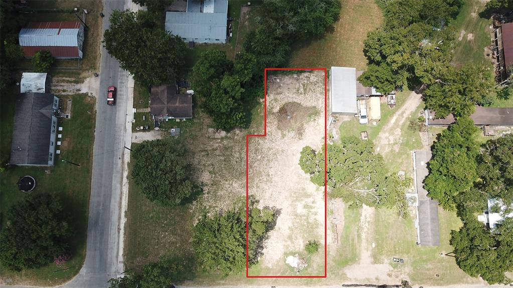 a aerial view of a house with a yard and garden