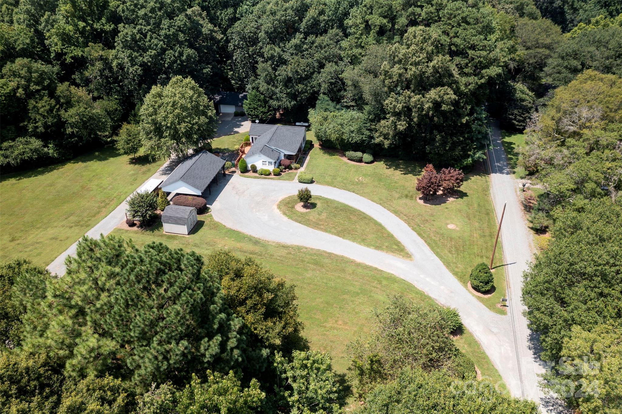 a view of a swimming pool with a yard