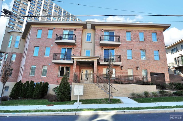 a front view of a multi story residential apartment building