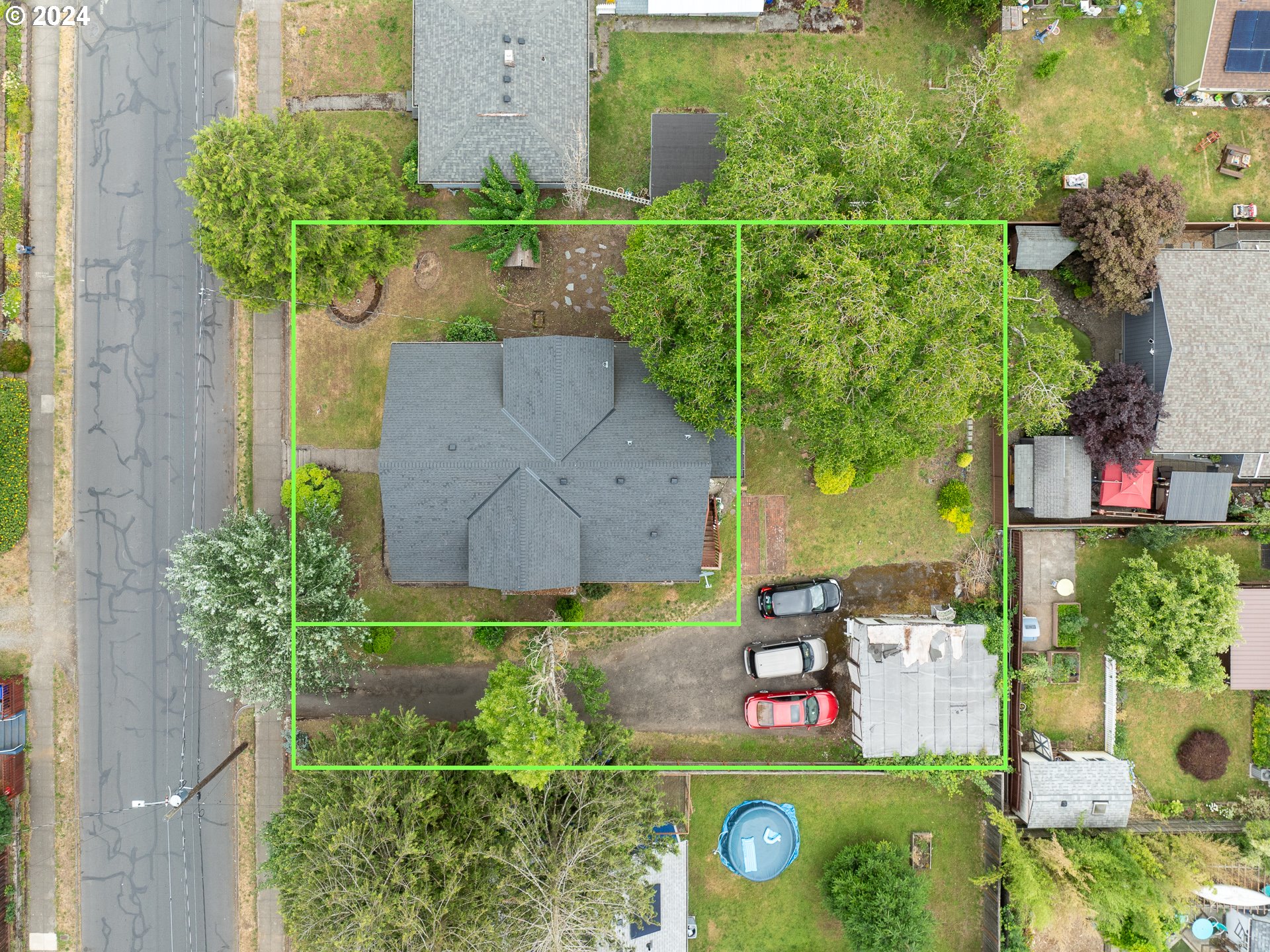 an aerial view of a house with a yard