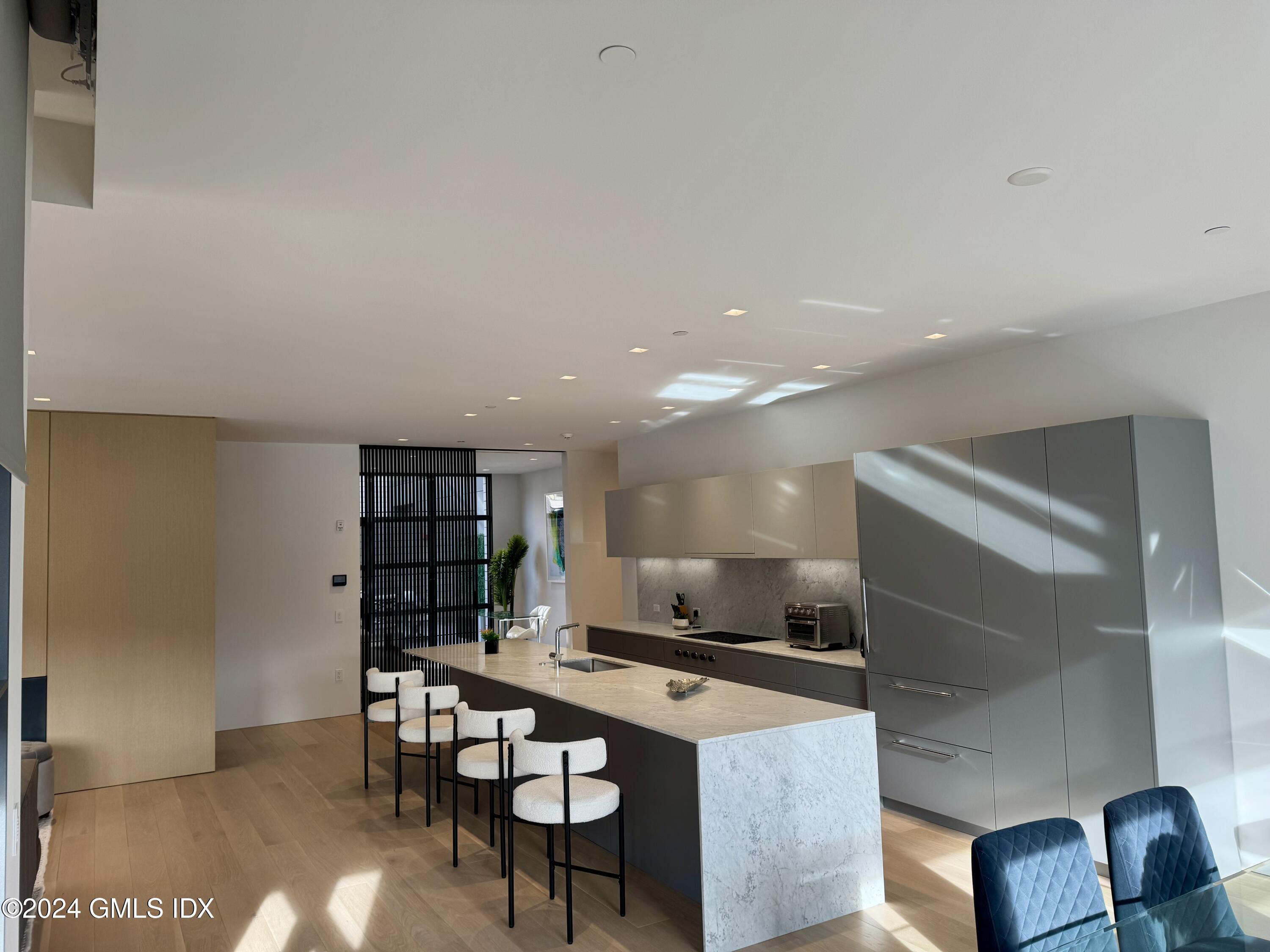 a kitchen with a table and chairs in it