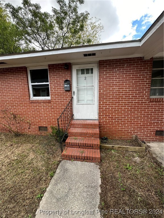 a front view of a house with stairs