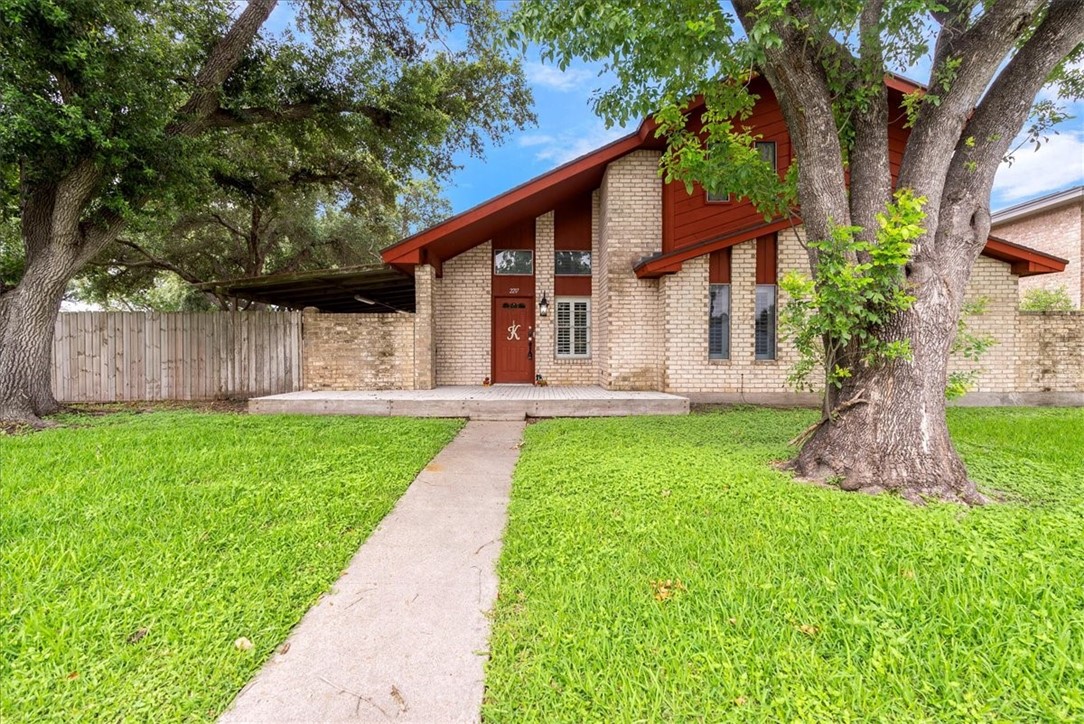 front view of a house with a yard