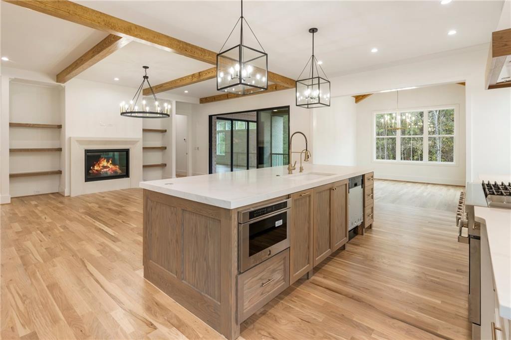 a kitchen with a stove and a kitchen island