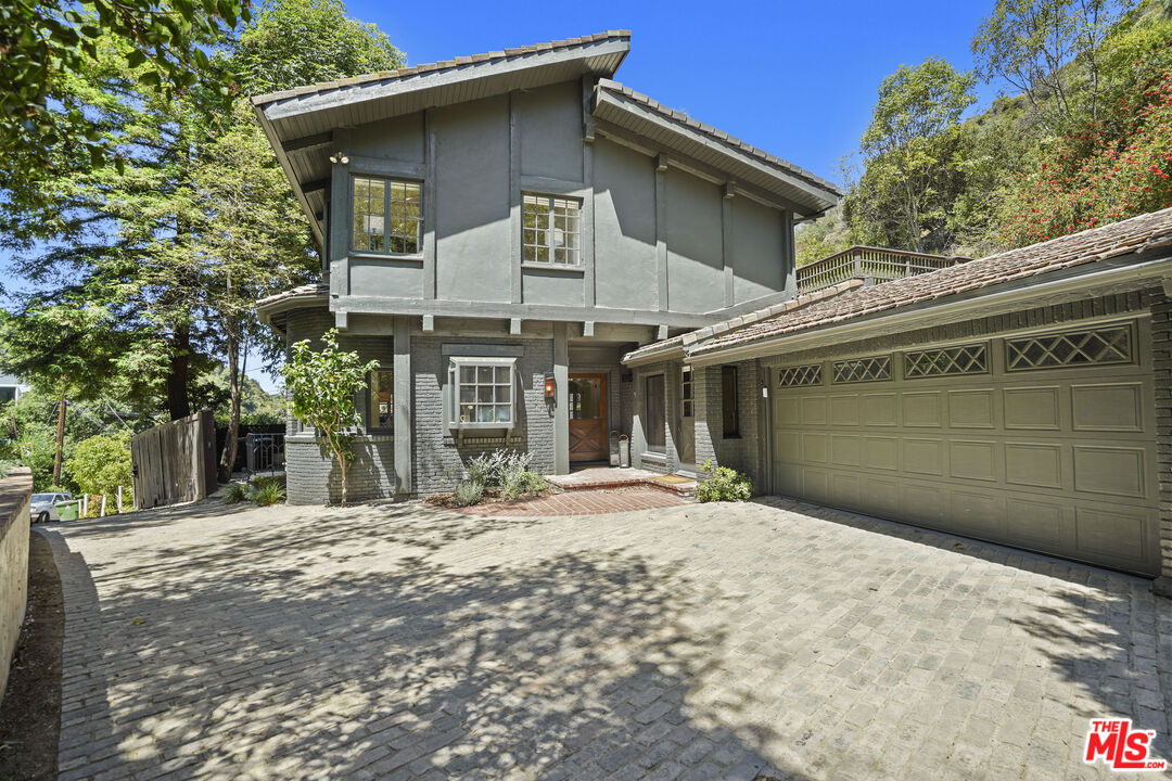 a front view of a house with a outdoor space