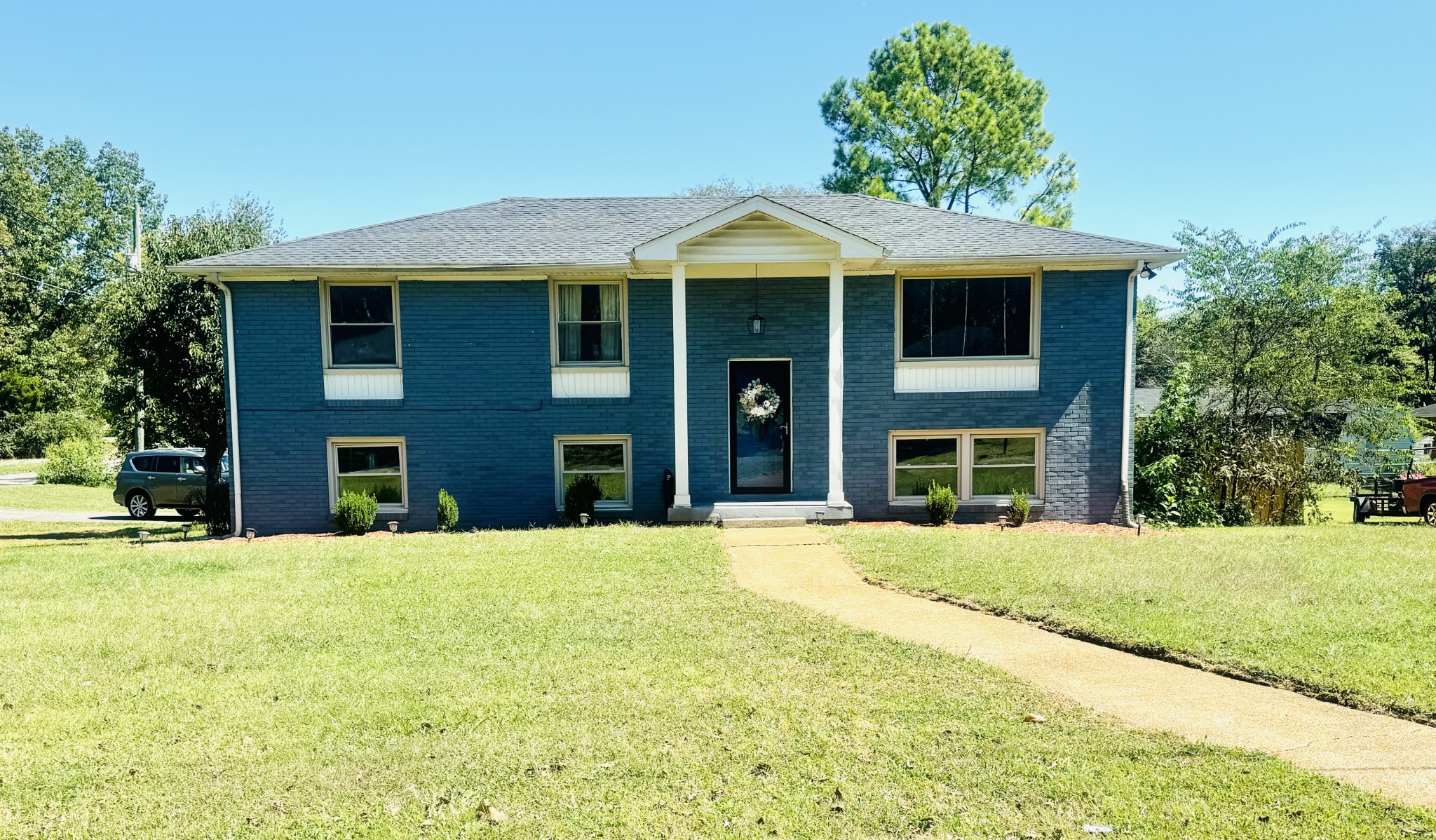 a front view of a house with a yard