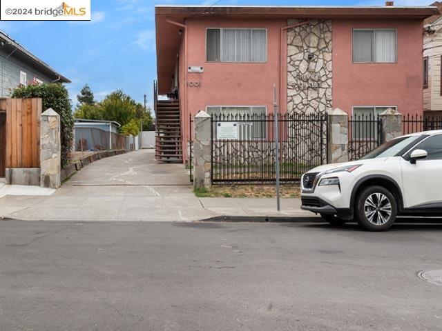 a view of a car parked in front of a building