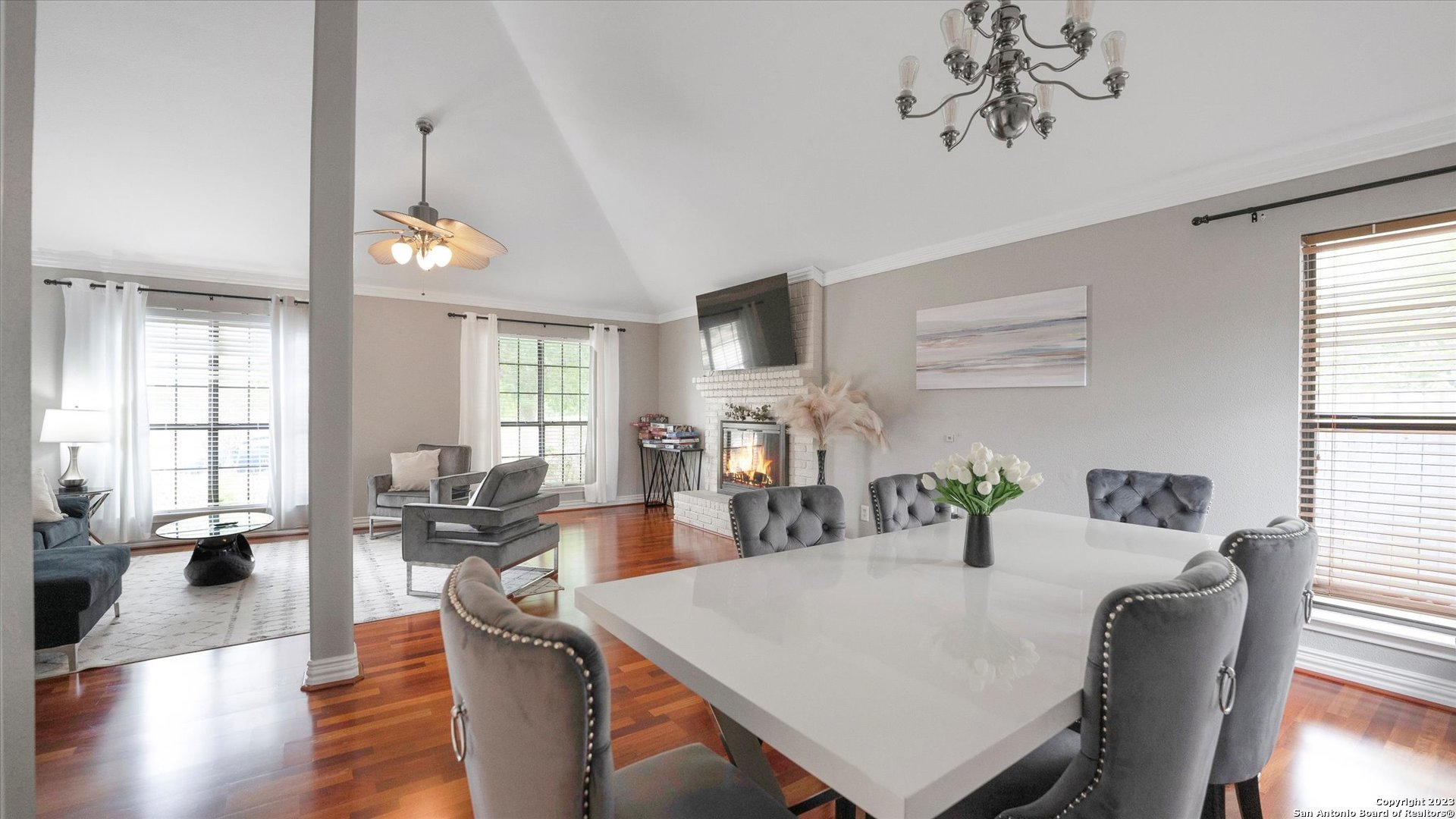 a view of a dining room with furniture and wooden floor