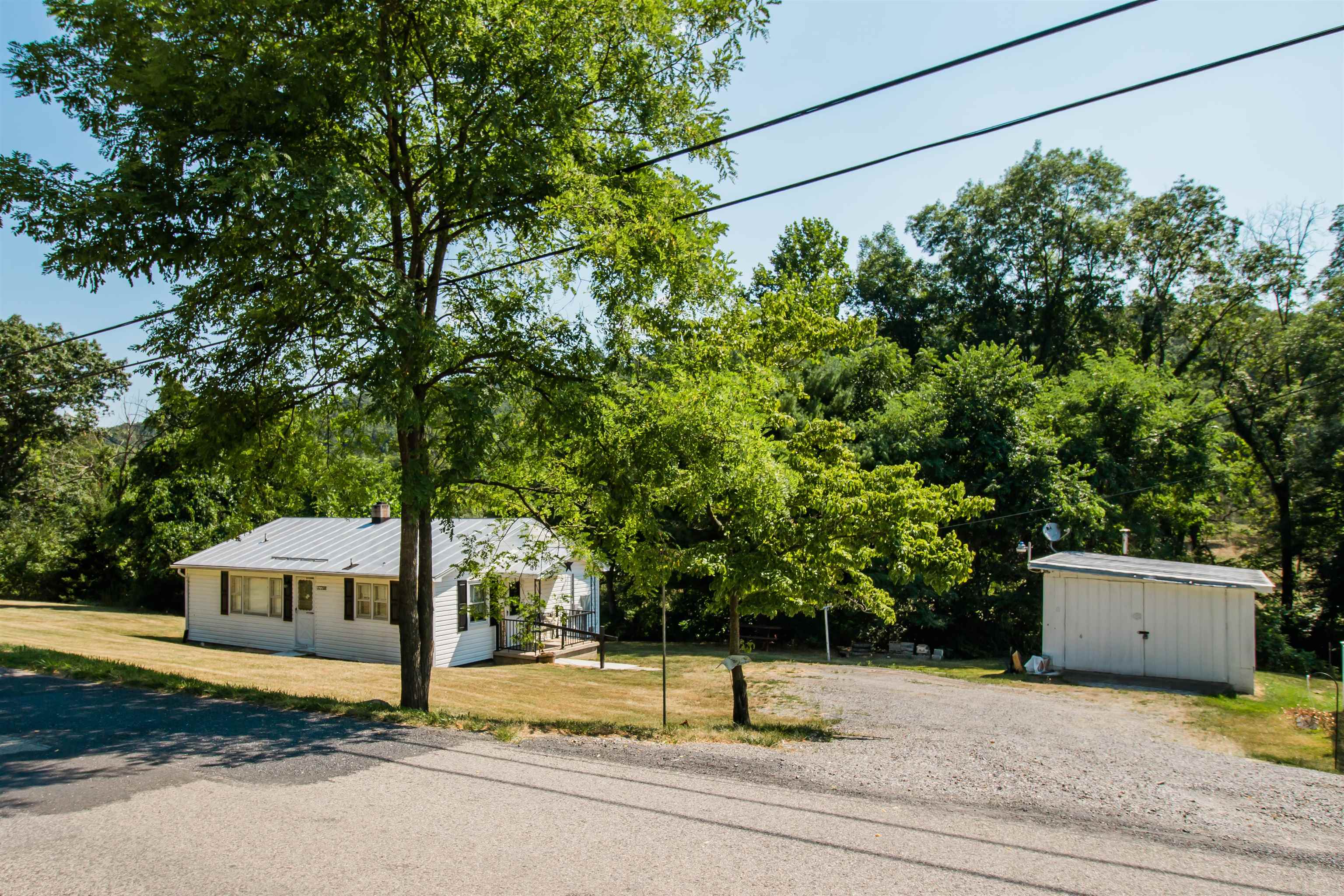 a house with a tree in front of it