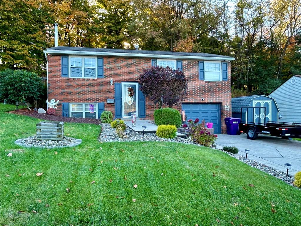 a front view of house with yard and outdoor seating