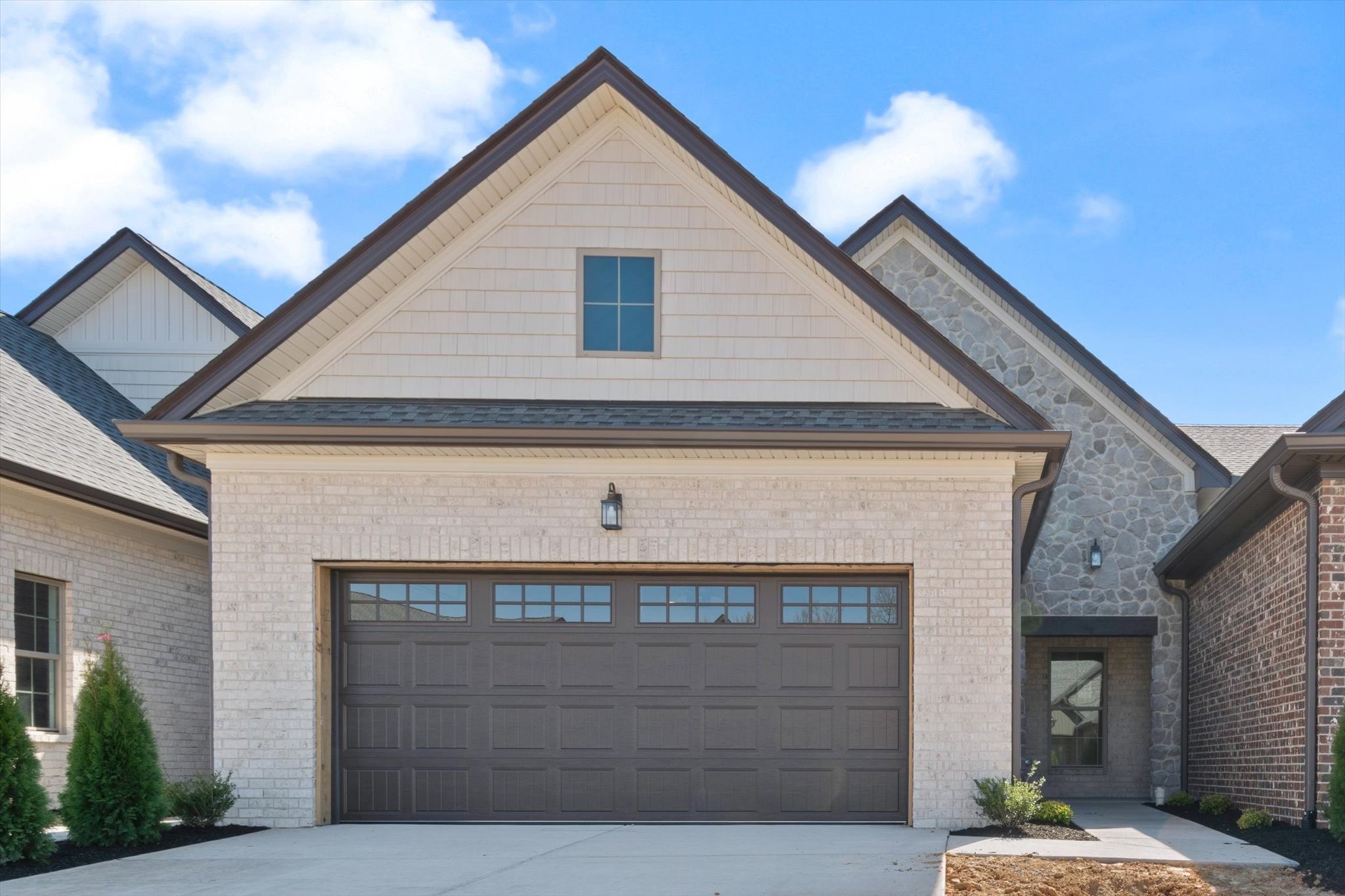 a front view of a house with a garage