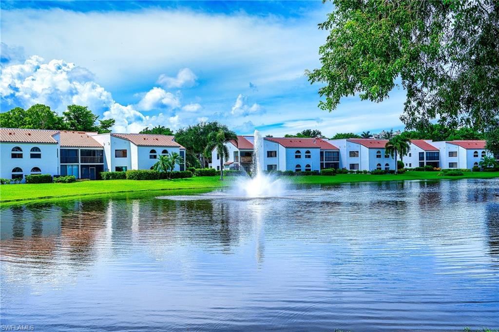 a view of a lake with a house in the background