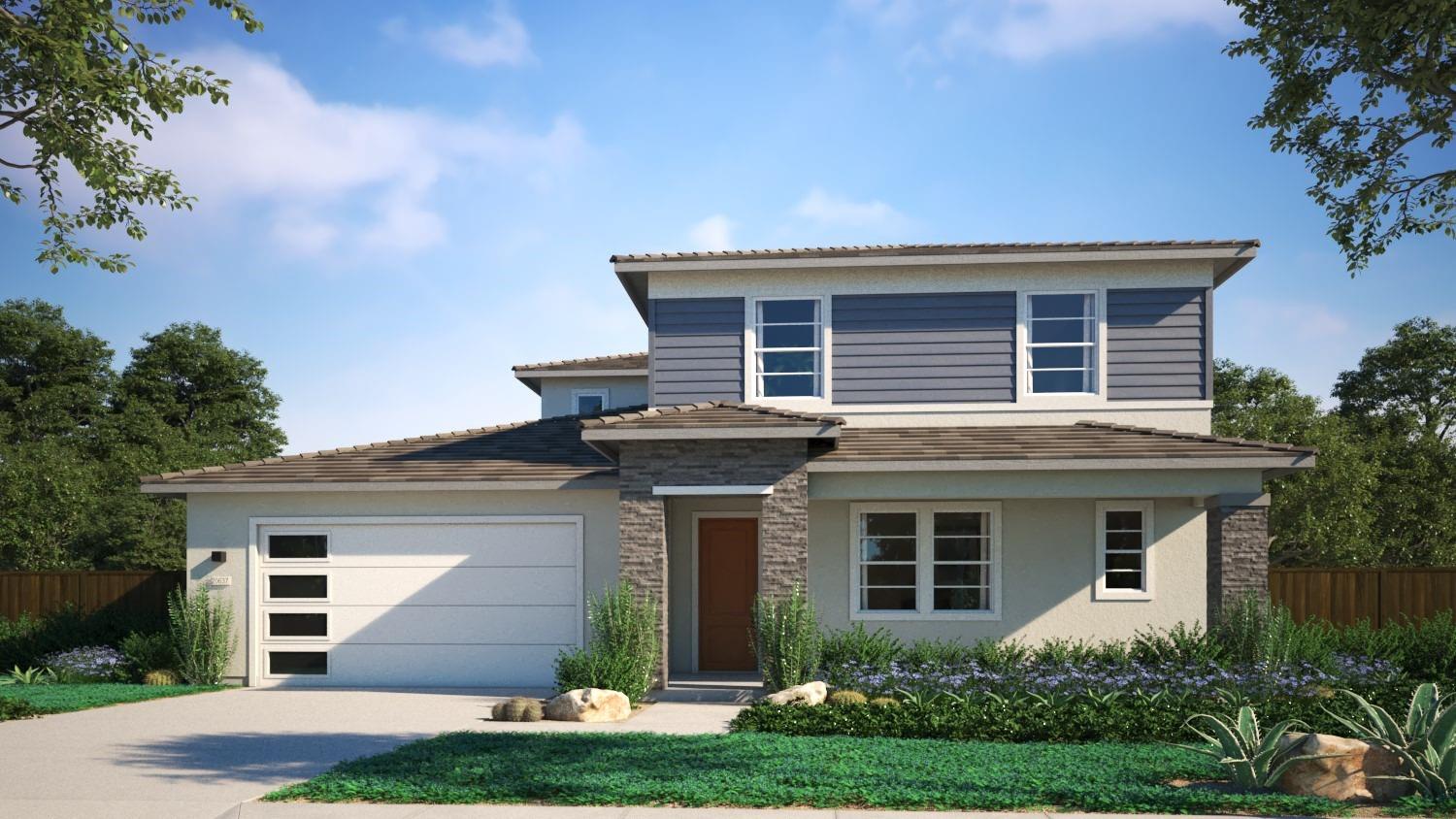 a front view of a house with a yard garage and outdoor seating